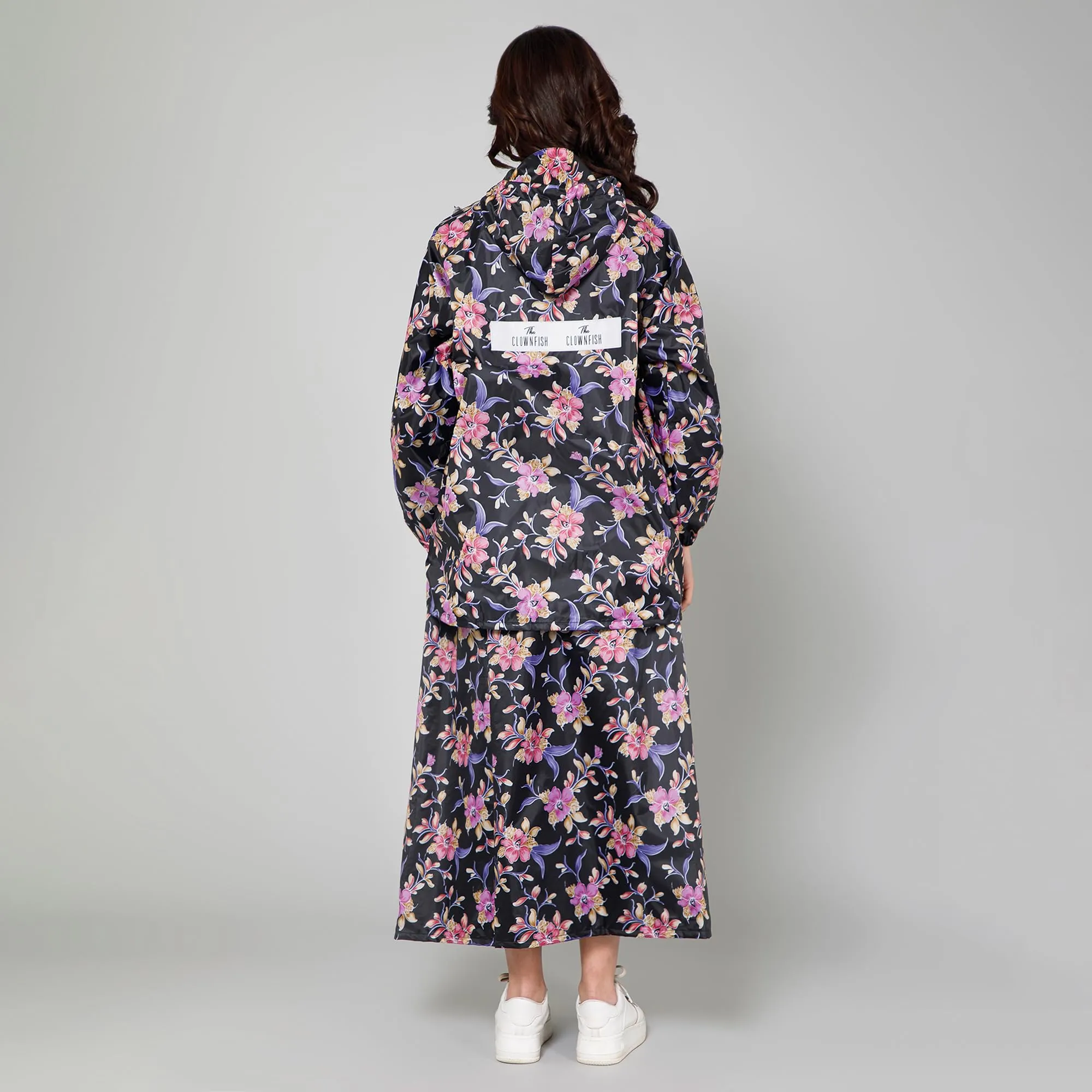 THE CLOWNFISH Polyester Waterproof Rain Coat For Women Skirt And Top Standard Length Raincoat With Adjustable Hood And Front Pockets Rain Glam Series (Black Floral, Xl)